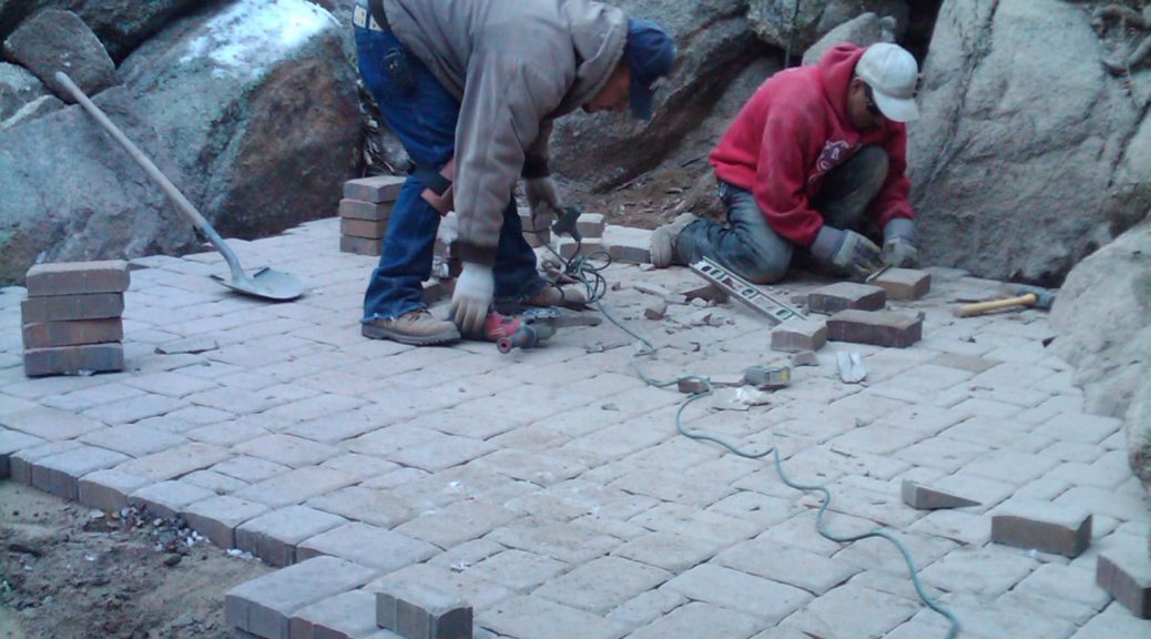 workers from vicente landscaping doing paver work