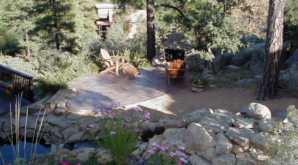 Water feature and patio of a backyard in Northern Arizona